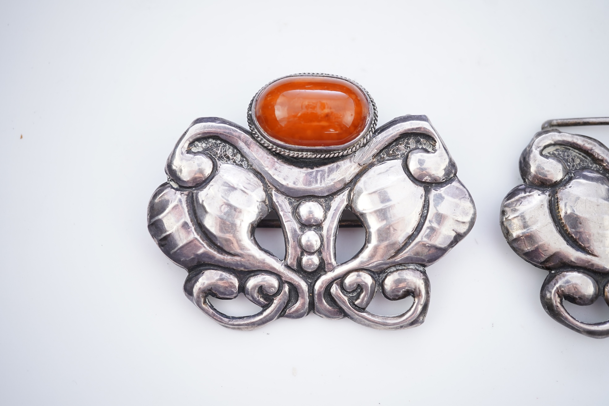 An Arts & Crafts silver and amber buckle, Denmark, early-mid 20th century
